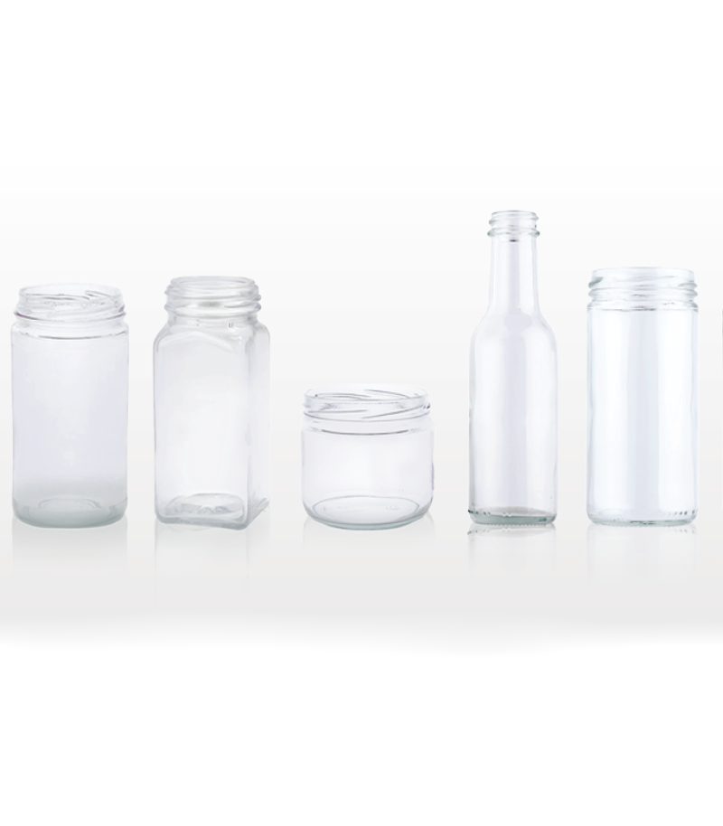 Various types and sizes of glass bottles used in packaging.
