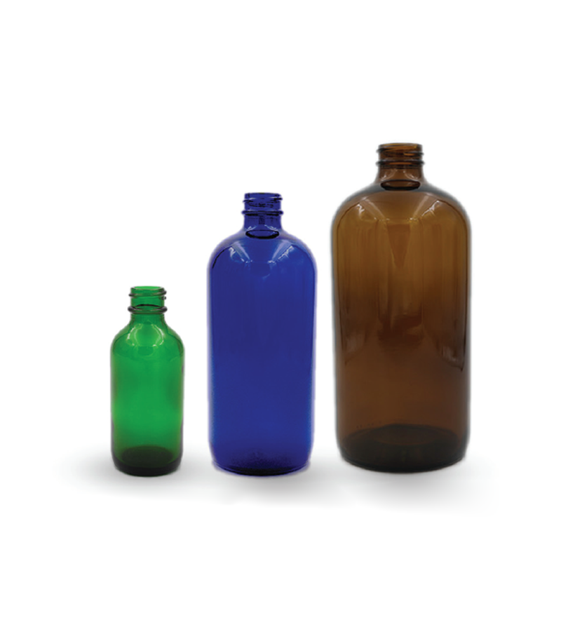 Various types and sizes of Boston round glass bottles used in packaging pharmaceuticals, essential oils, cosmetic products, and food items.